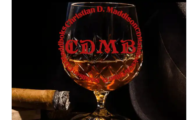 A lit cigar on a humidor, a glass of brandy, with the words; CDMaddbooks and Christian D Maddison on a circle on the glass, and a fedora. 
